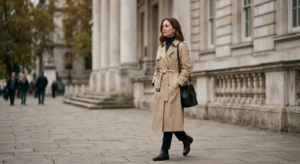 A sophisticated editorial composition featuring a woman in a timeless, minimalist beige trench coat